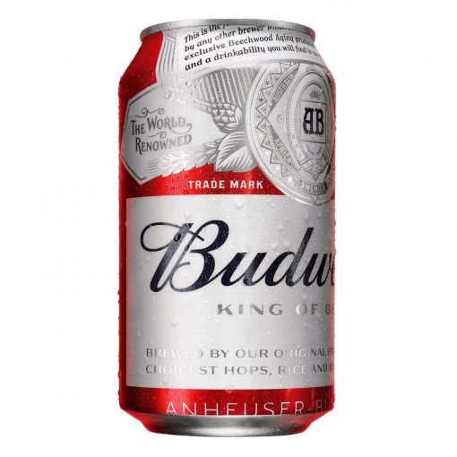 Una lata refrescante de Budweiser con gotas de condensación junto a un letrero de "Motel con jacuzzi en Bucaramanga".